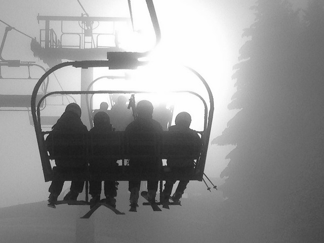 Breaking through the morning mist on La Croix chairlift, Les Gets.